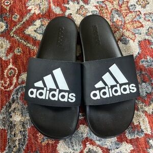 Adidas slides for men size 9. Never worn. Just like new.